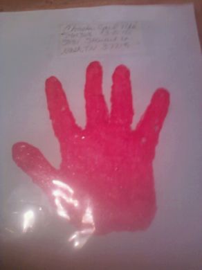 Christa Pike wax hand print and affixed signature